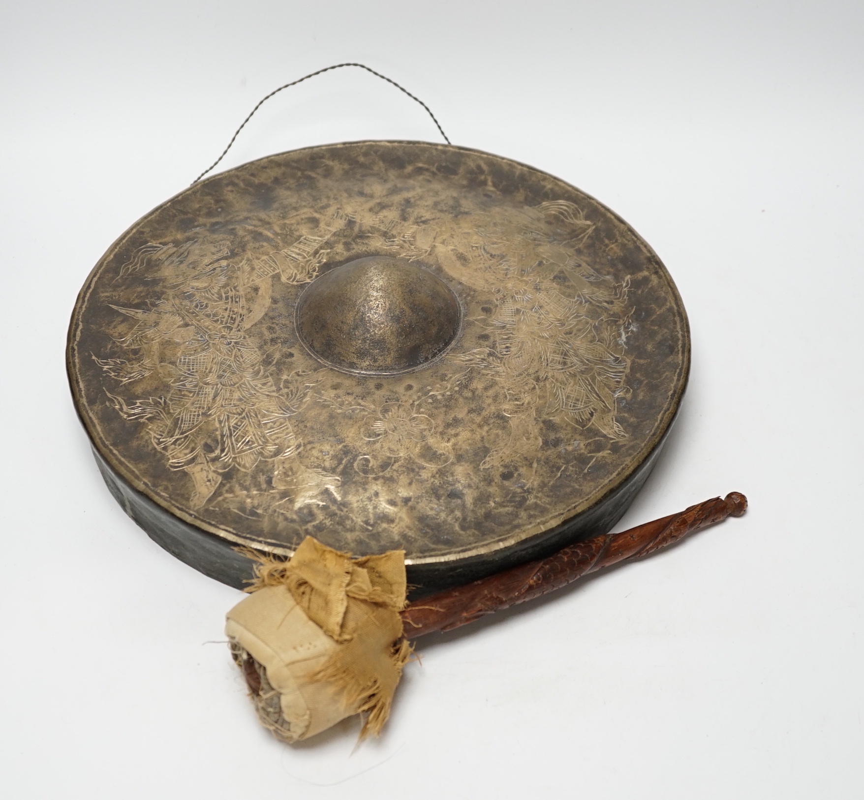 An Indonesian silver plated gong and beater, gong 33cm diameter